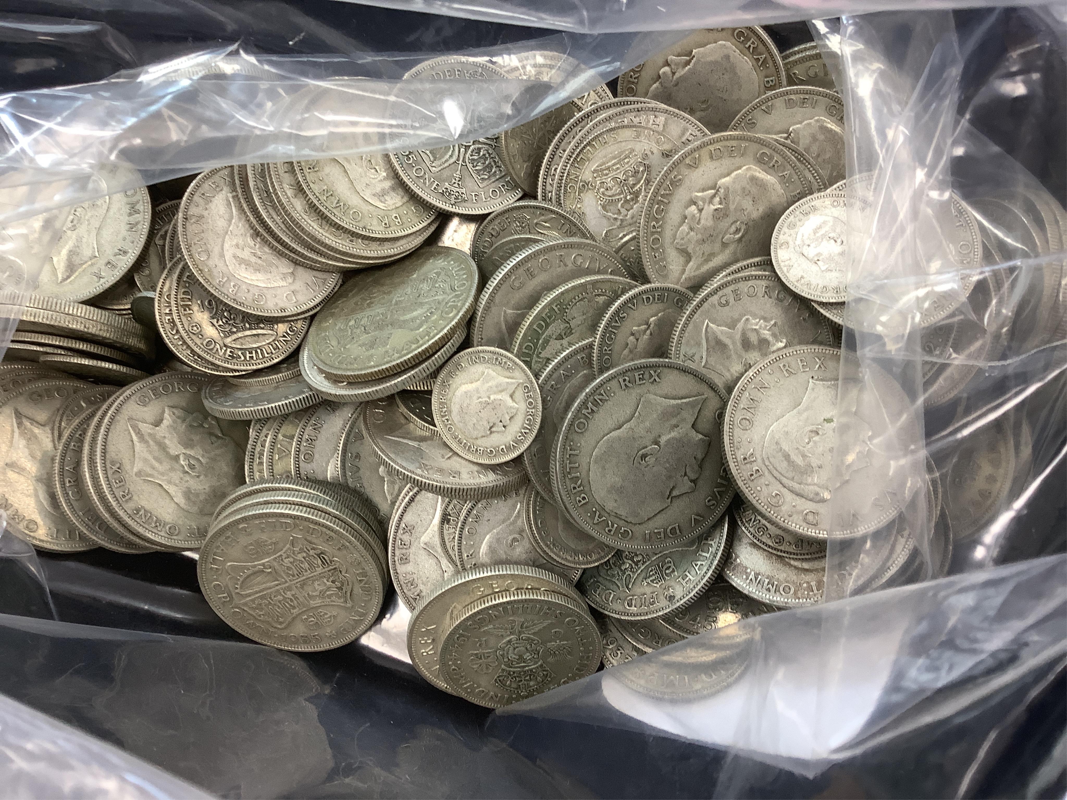 British silver coins, a large quantity of George V and George VI worn half crowns, florins, shillings and sixpences, 1920-1946, together with a Battle of Britain commemorative base metal medal